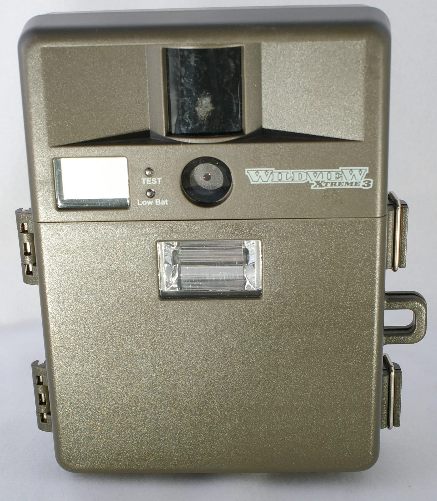 Front of a trail camera showing its motion sensor, lens and flash